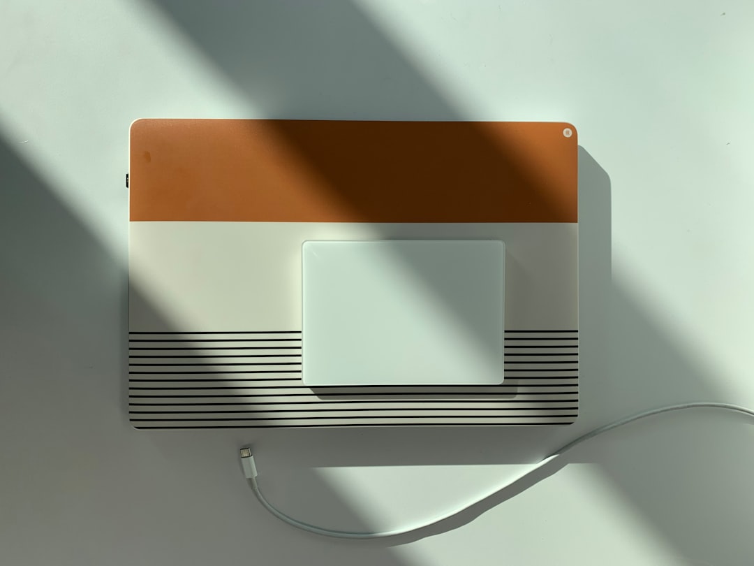 a white and brown wall mounted light switch